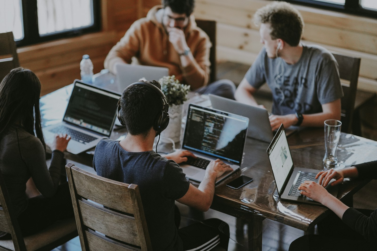 The team collaborating over a laptop
